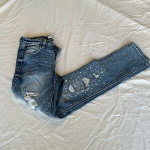 Black Daisy jeans with gem embellishments and rips w/ silver lining 26.5” inseam